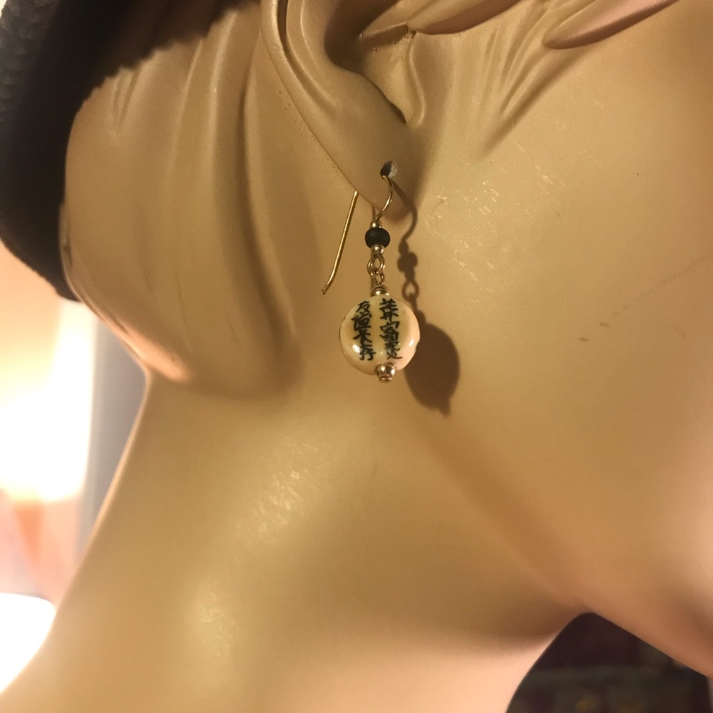 Gold tone oriental earrings